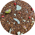 Mezcla de rooibos con trozos de pistacho, chocolate blanco y bayas rojas en grano.