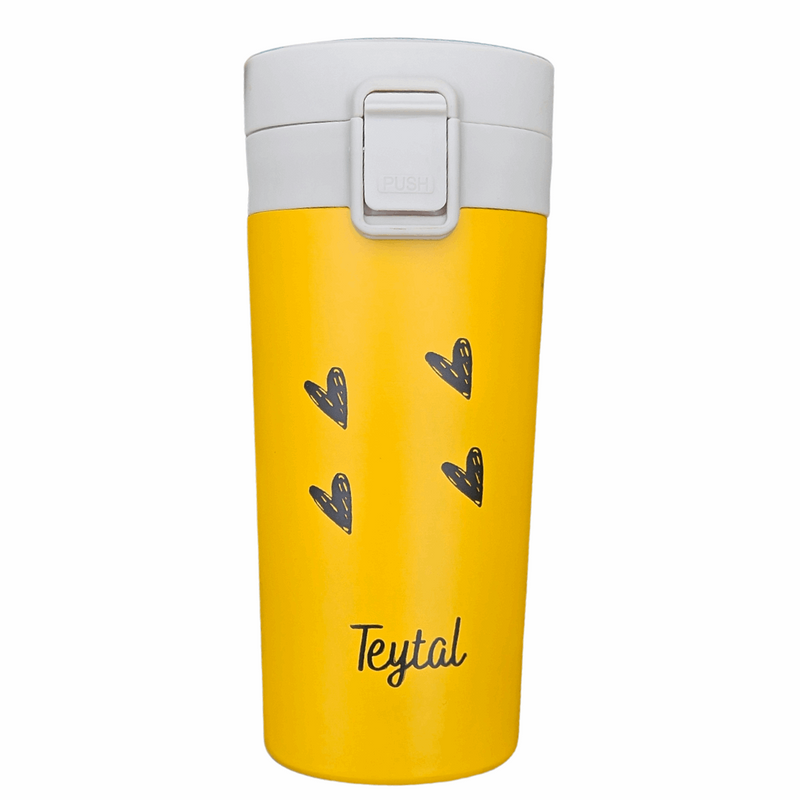 Termo amarillo de acero inox con tapa blanca, corazones negros y texto Teytal.